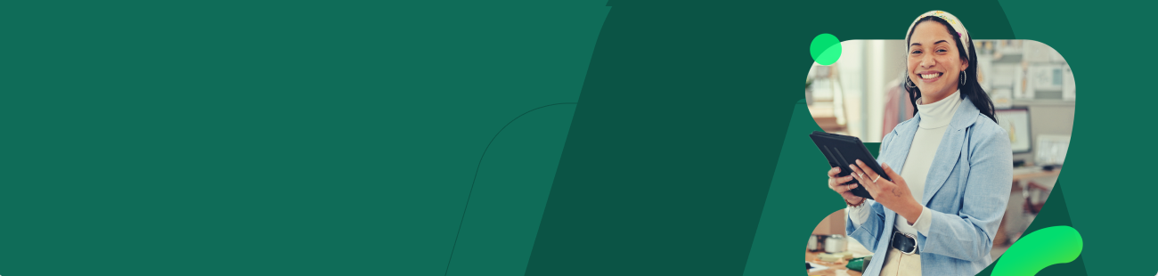 Graphic banner with a predominantly green background featuring layered abstract shapes. On the right side, there is a rounded rectangular cutout containing a person standing indoors and holding a digital tablet with both hands. The person is wearing a light blue blazer over a light-colored top and has a head covering with a patterned design. The indoor environment in the background includes shelves, office supplies, and workspace elements, softly out of focus. The left side of the banner is empty, filled only with decorative green shapes designed for layout balance and text placement.