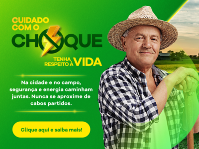 Banner informativo com fundo verde sobre segurança com energia elétrica. À direita, uma pessoa adulta em ambiente rural segura uma ferramenta agrícola, usando chapéu de palha e camisa xadrez, com paisagem de campo ao fundo. À esquerda, texto em destaque: ‘Cuidado com o choque. Tenha respeito à vida’. Abaixo, mensagem: ‘Na cidade e no campo, segurança e energia caminham juntas. Nunca se aproxime de cabos partidos’. Na parte inferior, um botão amarelo com o texto: ‘Clique aqui e saiba mais!’.